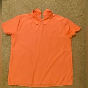 Bright beautiful shirt. It’s silky but polyester and comfortable.